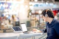 Young Asian business man listening to music while working with l Royalty Free Stock Photo