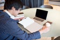 Young Asian man reading book in workspace of library Royalty Free Stock Photo