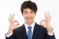 Young Asian business man showing okay sign Royalty Free Stock Photo