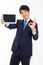 Young Asian business man showing a pad PC