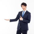 Young Asian business man showing something Royalty Free Stock Photo