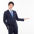 Young Asian business man showing something Royalty Free Stock Photo