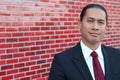 Young asian business man smiling standing indoor with copy space on the left side of the picture Royalty Free Stock Photo