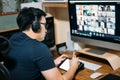 Young asian business man using computer for a online business meeting with his colleagues about plan in video conference. back Royalty Free Stock Photo