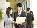 Young asian business man and woman working together in office Royalty Free Stock Photo