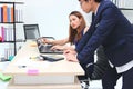 Young Asian business people working together in office. Royalty Free Stock Photo