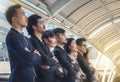 The young Asian business team stands with confidence and pride. Royalty Free Stock Photo