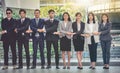 The young Asian business team stands with confidence and pride. Royalty Free Stock Photo