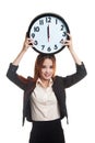 Young Asian business woman with a clock.