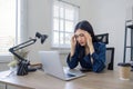 Young Asian business woman is having trouble controlling her online work in front of a laptop screen. Serious Asian Royalty Free Stock Photo