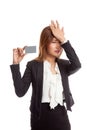 Young Asian business woman headache with a blank card Royalty Free Stock Photo