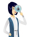 Young asian business woman with magnifying glass. Royalty Free Stock Photo