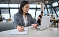 Young Asian business woman office employee using laptop watching webinar. Royalty Free Stock Photo