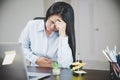 Young asian business woman person sitting at work and has stress pain in her stomach. Concept office syndrome abdomen pain from Royalty Free Stock Photo