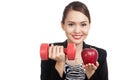 Young Asian business woman with red apple and dumbbells Royalty Free Stock Photo