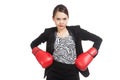 Young Asian business woman with red boxing gloves Royalty Free Stock Photo