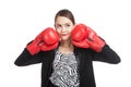 Young Asian business woman with red boxing gloves Royalty Free Stock Photo