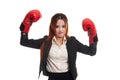 Young Asian business woman with red boxing gloves. Royalty Free Stock Photo