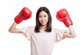 Young Asian business woman with red boxing gloves. Royalty Free Stock Photo