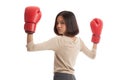 Young Asian business woman with red boxing gloves Royalty Free Stock Photo