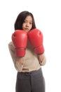 Young Asian business woman with red boxing gloves Royalty Free Stock Photo