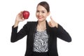 Young Asian business woman show thumbs up with red apple Royalty Free Stock Photo
