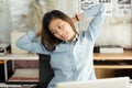 Young asian business woman sitting on the chair stretch oneself Royalty Free Stock Photo