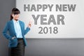 Young asian business woman standing with Happy New Year 2018 tex Royalty Free Stock Photo