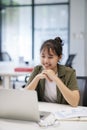 Young asian business woman or student working online on computer laptop. Royalty Free Stock Photo