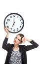 Young Asian business woman thumbs down with a clock Royalty Free Stock Photo