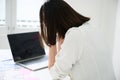 Young asian business woman upset or stressed feeling strain working on computer laptop in office room Royalty Free Stock Photo