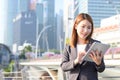 Young Asian business woman using laptop working in urban Royalty Free Stock Photo