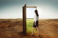 Young asian business woman walking to the open door going to green environment Royalty Free Stock Photo