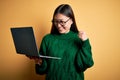 Young asian business woman wearing glasses and working using computer laptop very happy and excited doing winner gesture with arms Royalty Free Stock Photo