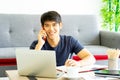 Young Asian businessman using teleconference from notebook laptop.  social distancing new normal concept Royalty Free Stock Photo