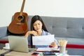 Young Asian business woman work from home using teleconference from notebook laptop. Royalty Free Stock Photo