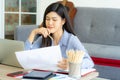 Young Asian business woman work from home using teleconference from notebook laptop. Royalty Free Stock Photo