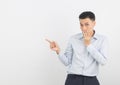 Young asian businessman with blue shirt excited with hands covering mouth isolated on white background.