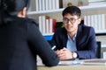 Young asian businessman at business meeting, job interview, in office, business people, office lifestyle concept Royalty Free Stock Photo