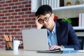 Young asian businessman concentrate on working with laptop computer at office, Asian office man comtemplate on working with laptop Royalty Free Stock Photo