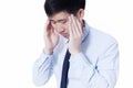 Young Asian businessman facing headache / migraine problems in white isolated