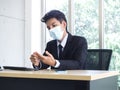 Young Asian businessman pain while using notebook computer in office Royalty Free Stock Photo