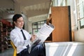 Young Asian businessman reading a newspaper Royalty Free Stock Photo