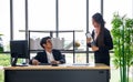 Young Asian businessman and a secretary in the office Together, work until completion Royalty Free Stock Photo