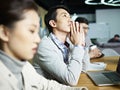 Young asian businessman thinking during meeting Royalty Free Stock Photo