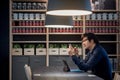 Young Asian businessman using smartphone and tablet in co working space Royalty Free Stock Photo