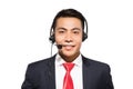 Young asian businessman wearing headset, studio shot. Royalty Free Stock Photo