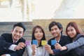 These young Asian businessmen hold hold jigsaw puzzles for each Royalty Free Stock Photo