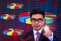 Young Asian businessmen, wearing dark glasses and black suits, pointing fingers pointing graph, Eyes are committed, in the work,