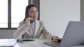 Young asian businesswoman beautiful charming smiling and talking on the mobile phone in the office. Royalty Free Stock Photo